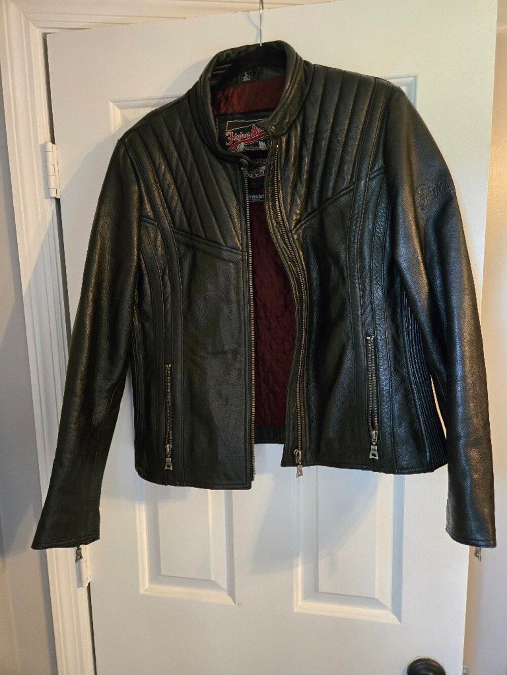 Black motorcycle jacket with zipped sleeves to keep you warm